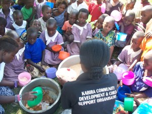 feeding the underprivillegde children of Kabira Community Primary School